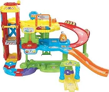 VTech Baby Flitzer - Parking Garage - Interactive Toy with Tow Truck, Lift, Slide, Gas Station and Much More - For Children Aged 1-5 Years: Amazon.de: Baby Products